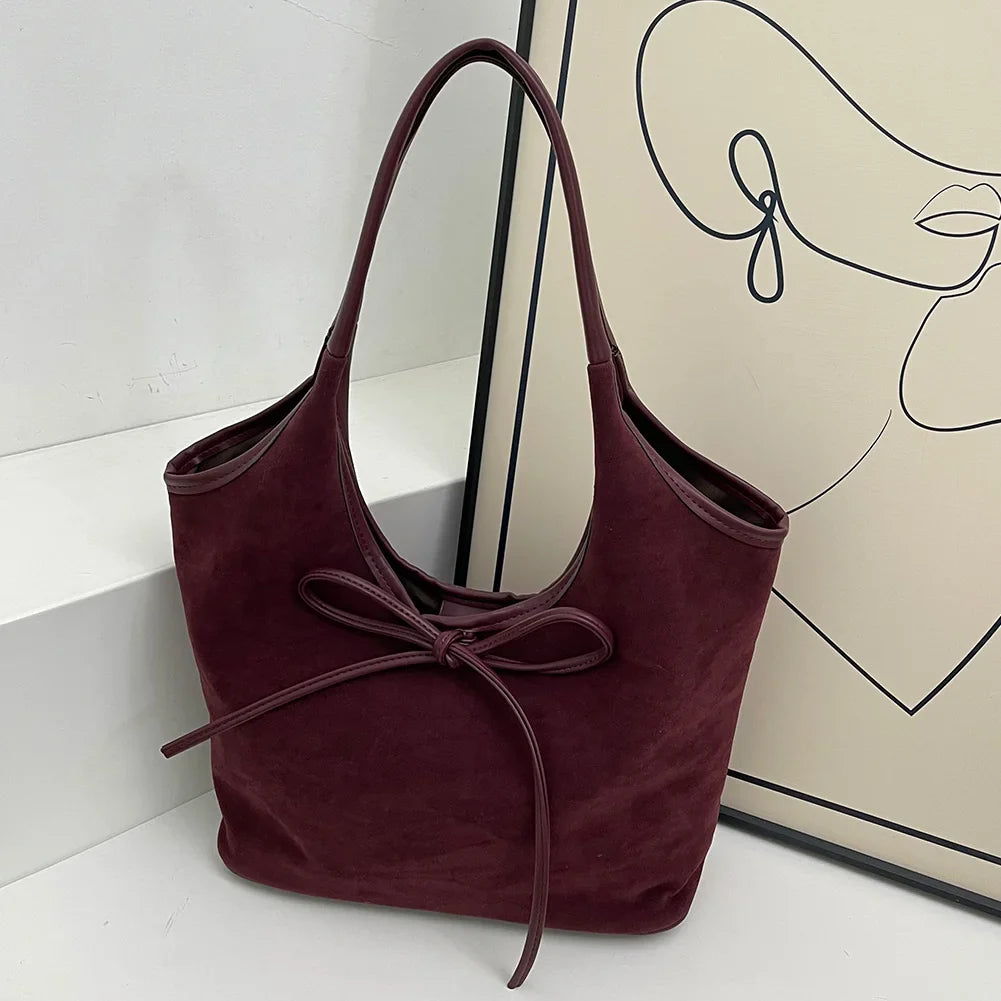 Vegan suède schoudertas met strikdetail – Alessa