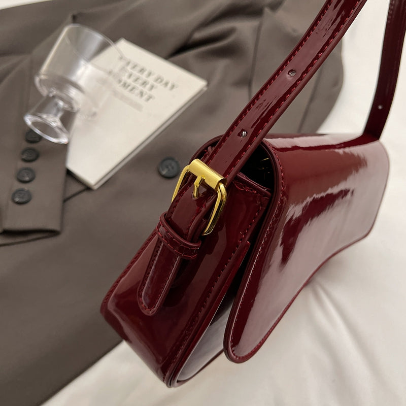 Glanzende schoudertas met golvend design voor dames – Veluna