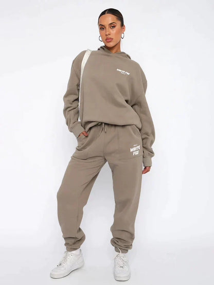Getailleerd dames trainingspak met hoodie – Lianne