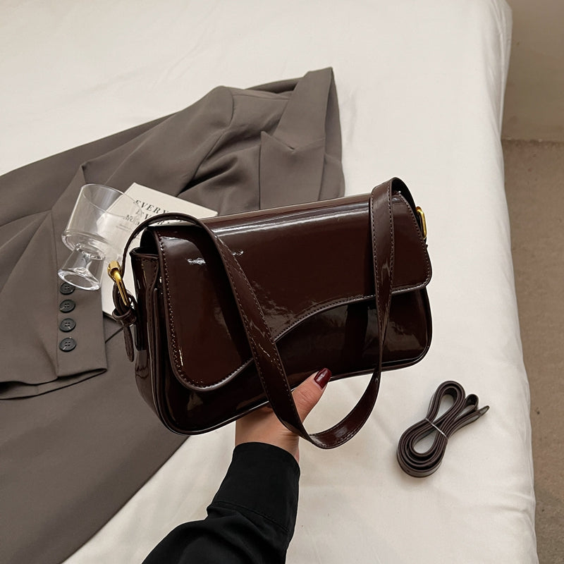 Glanzende schoudertas met golvend design voor dames – Veluna