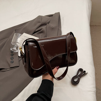 Glanzende schoudertas met golvend design voor dames – Veluna