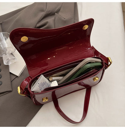 Glanzende schoudertas met golvend design voor dames – Veluna