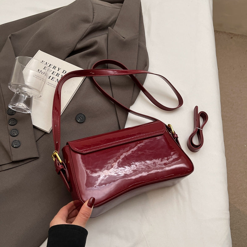 Glanzende schoudertas met golvend design voor dames – Veluna