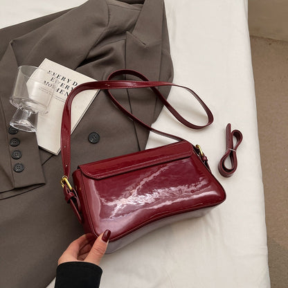 Glanzende schoudertas met golvend design voor dames – Veluna