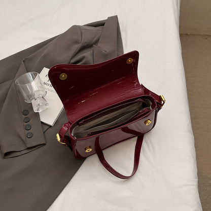 Glanzende schoudertas met golvend design voor dames – Veluna
