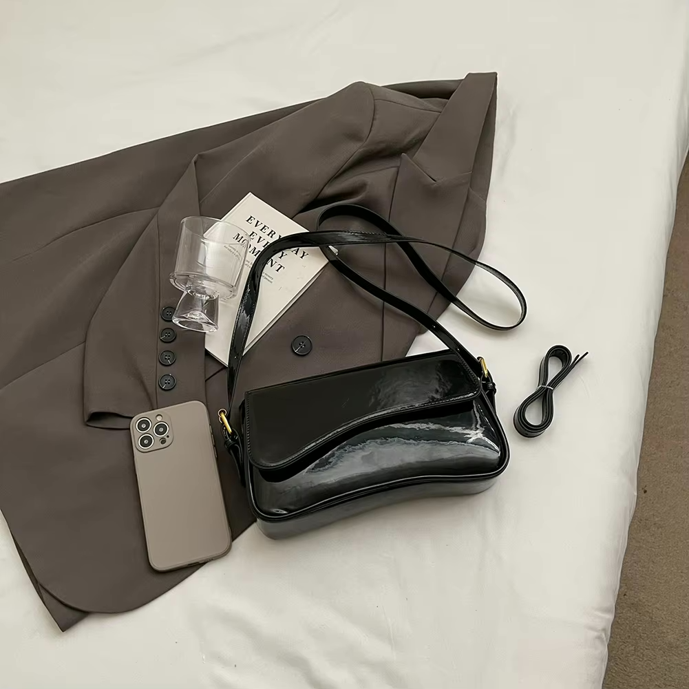 Glanzende schoudertas met golvend design voor dames – Veluna