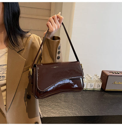 Glanzende schoudertas met golvend design voor dames – Veluna