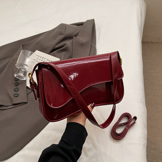 Glanzende schoudertas met golvend design voor dames – Veluna